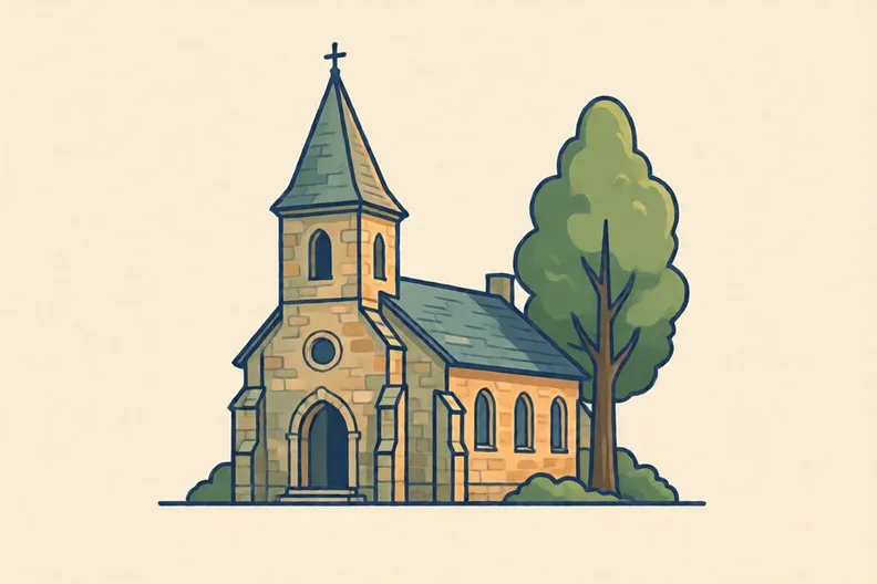 A small stone village church with a tall tree beside it, under a clear sky