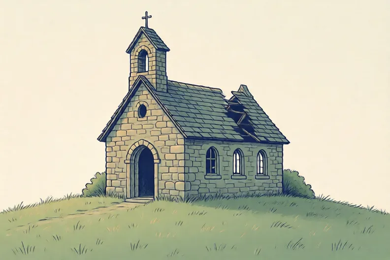 A stone church with a broken roof on a grassy hill