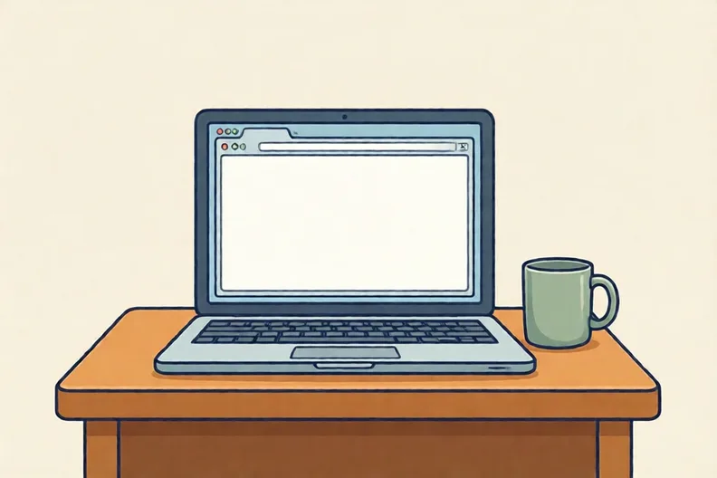 A laptop open on a wooden desk beside a mug, screen turned away from the viewer