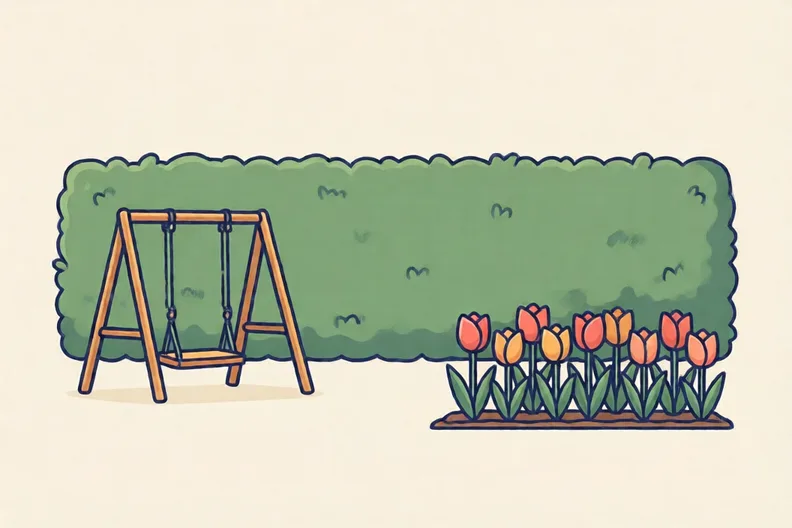 A tall hedge standing between a swing set and a flowerbed