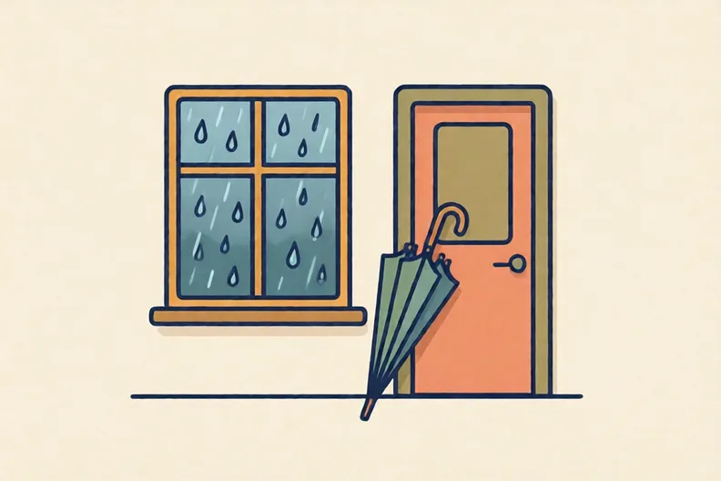 A rainy window with an umbrella leaning by the door