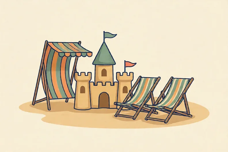 A sunny beach with a sandcastle and empty deckchairs, no people