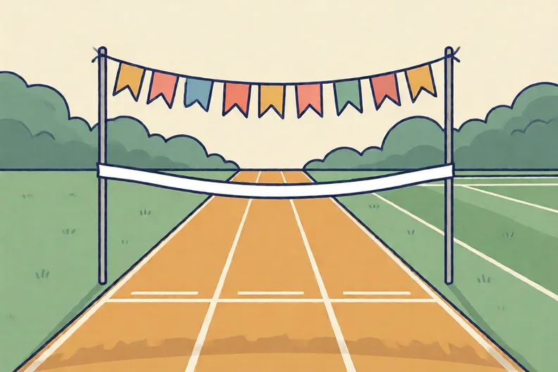A school sports day finish line with bunting and a white tape across the track