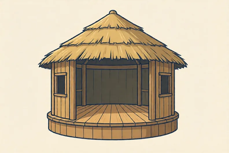 An empty open-air wooden playhouse with a round yard and a thatched roof in daylight