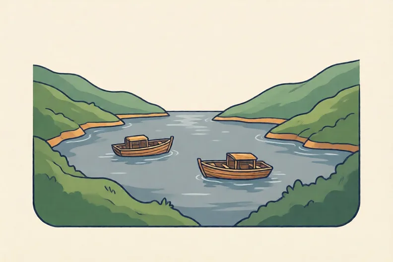 A grey sea between two coasts, with two small boats and no people