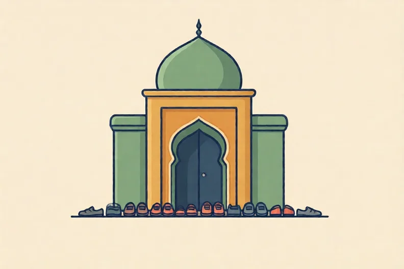A small masjid entrance with a row of shoes by the door