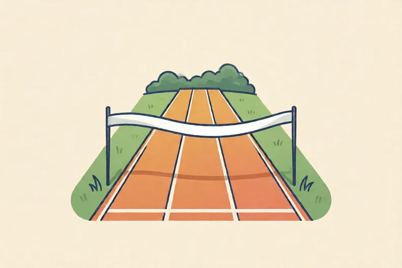 A finish line of tape across a grass track, with lane lines leading up to it