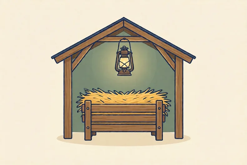 A wooden manger filled with straw in a plain stable