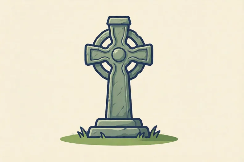 A stone Celtic cross standing on green grass